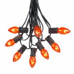 100 C7 String Light Set with Orange Bulbs on Black Wire