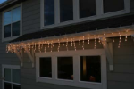Frosted Orange 100 Light Icicle Lights Black Wire Medium Drops