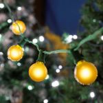 25 G40 Globe String Light Set with Yellow Bulbs on Green Wire