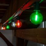 25 LED Filament G40 Globe String Light Set with Transparent Orange, Green & White Bulbs on Green Wire
